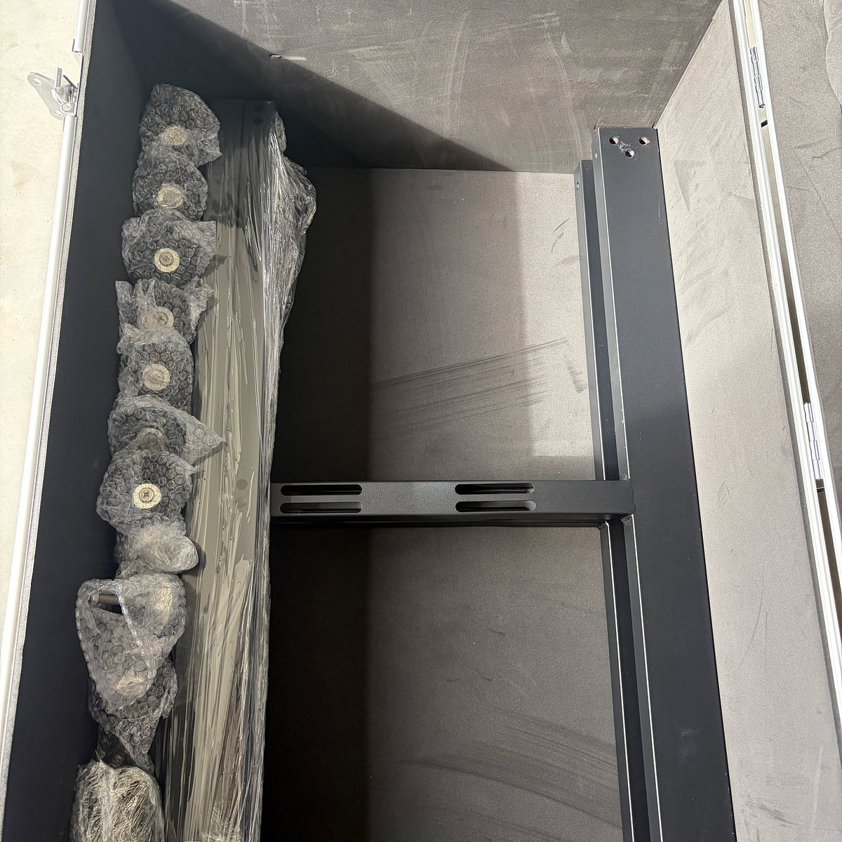 Hanging bars with carabiners, padded and packed in a flight case