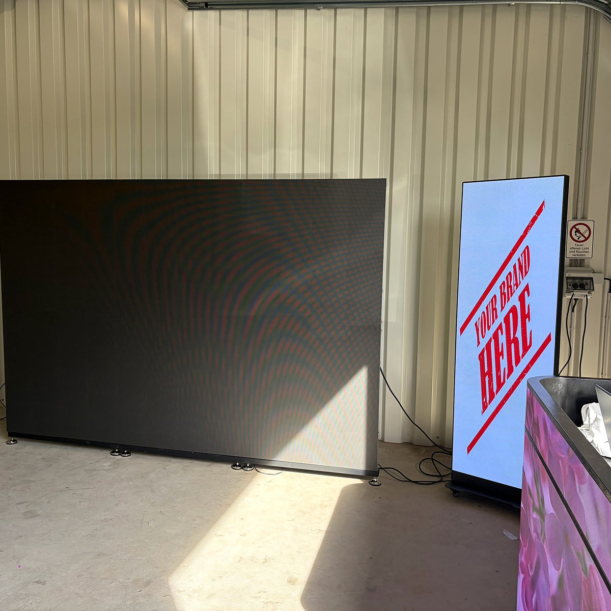 LED wall P2.97 in the workshop next to an LED screen poster and LED DJ desk